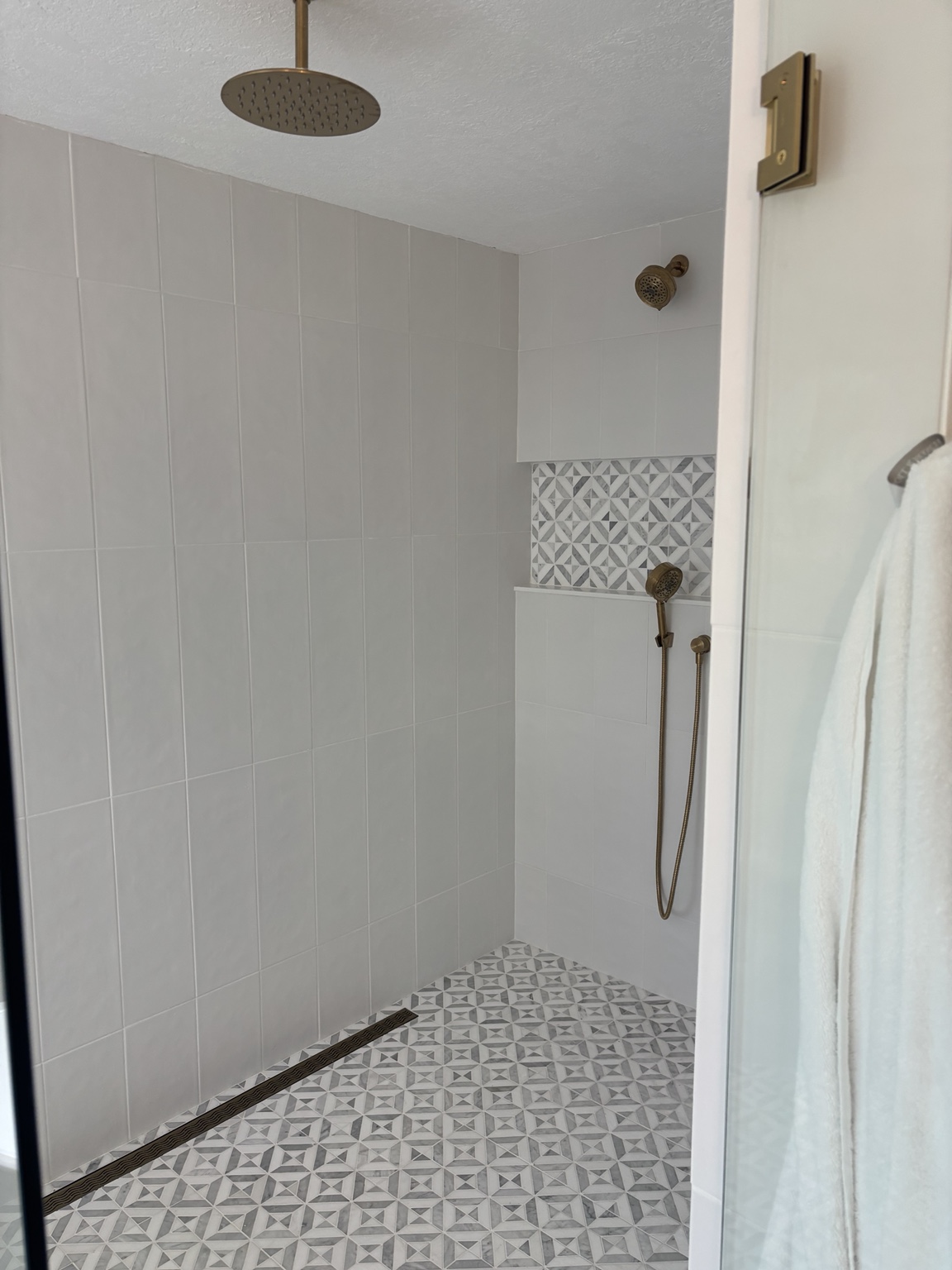 Finished walk-in shower after complete bathroom remodel