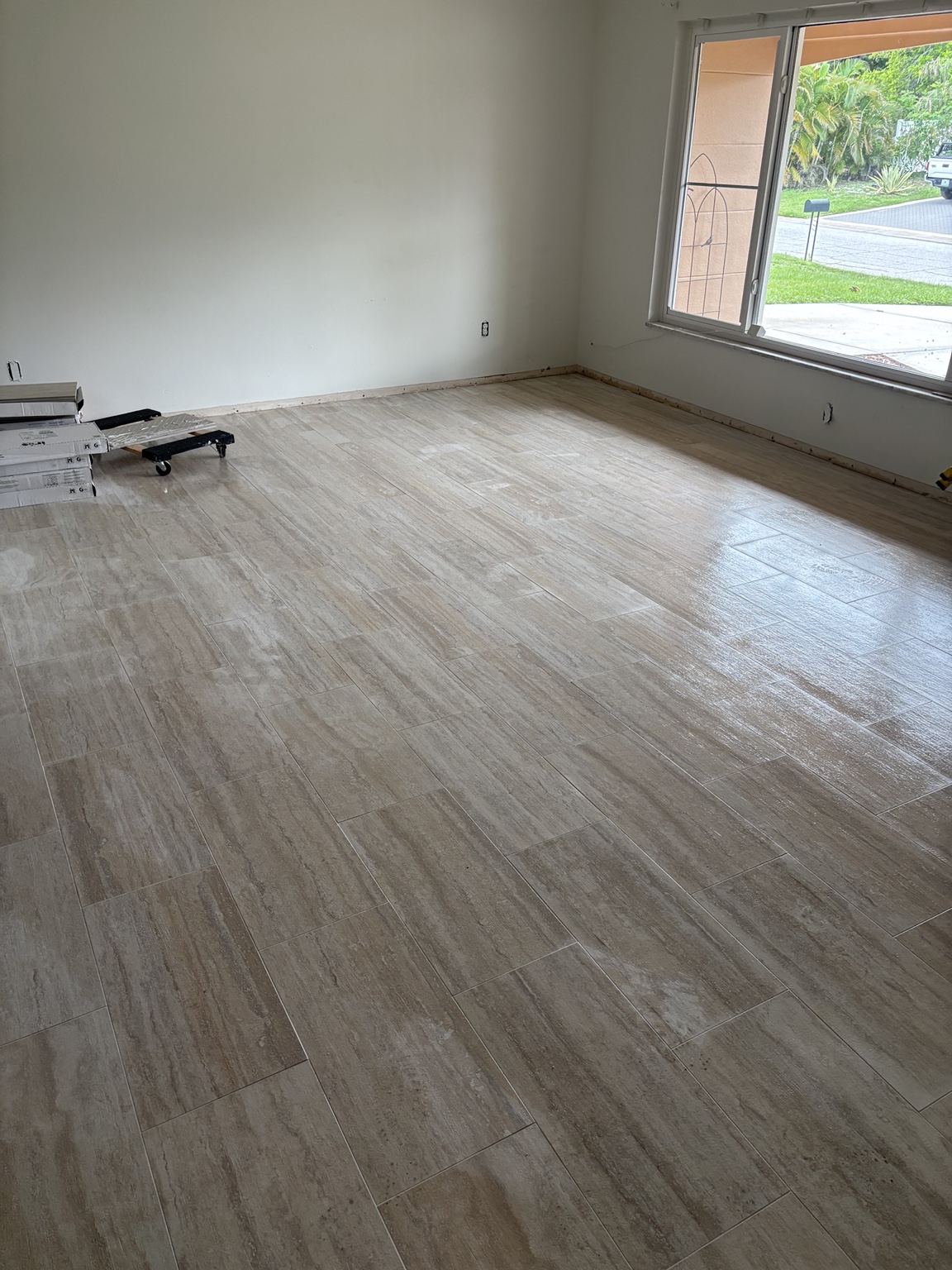Large room with finished tile flooring